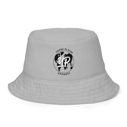 Young Player Apparel grey reversible bucket hat with black globe logo print for streetwear style.